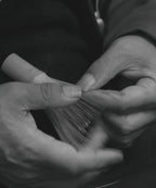 Close-up of Korean Master Heo's hands meticulously crafting the bamboo matcha whisk. This handcrafted chasen process ensures premium quality.