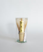 Korean bamboo chasen whisk packaged in a clear protective container. 100-prong design.