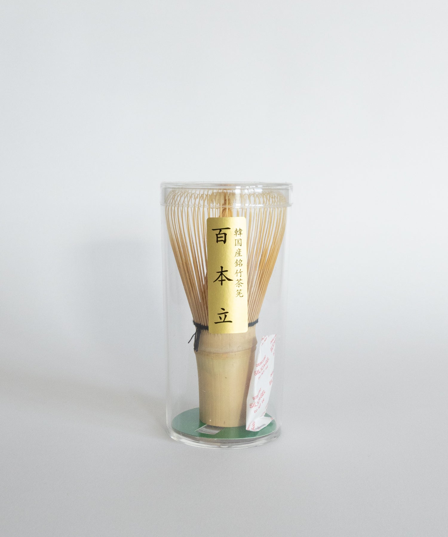 Korean bamboo chasen whisk packaged in a clear protective container. 100-prong design.