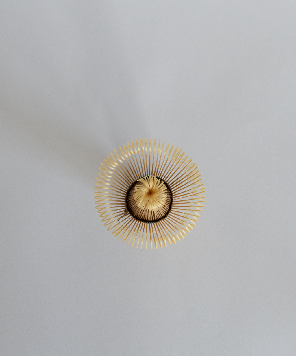 Top view of the 100-prong matcha bamboo whisk, showing the intricate craftsmanship.