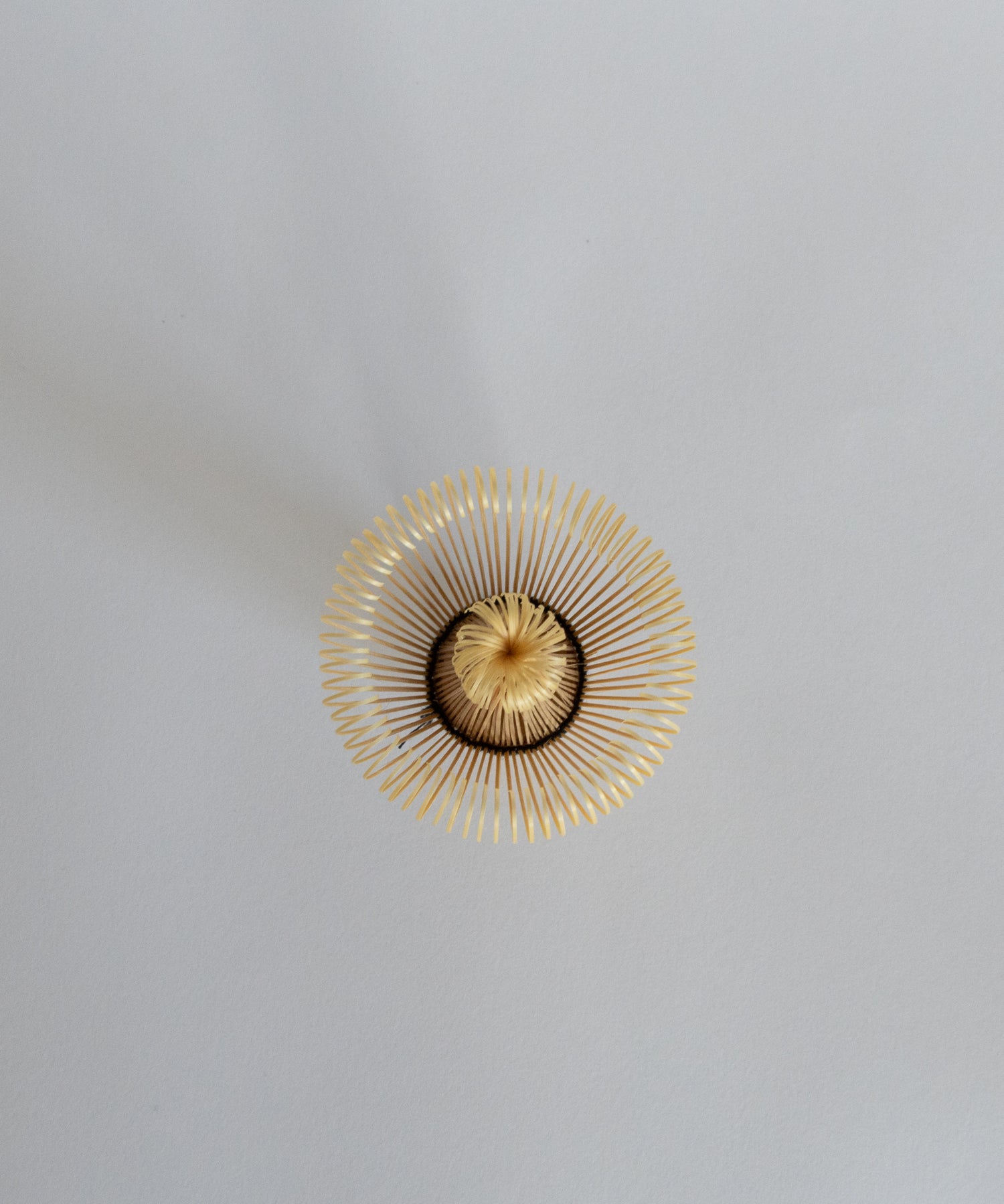 Top view of the 100-prong matcha bamboo whisk, showing the intricate craftsmanship.