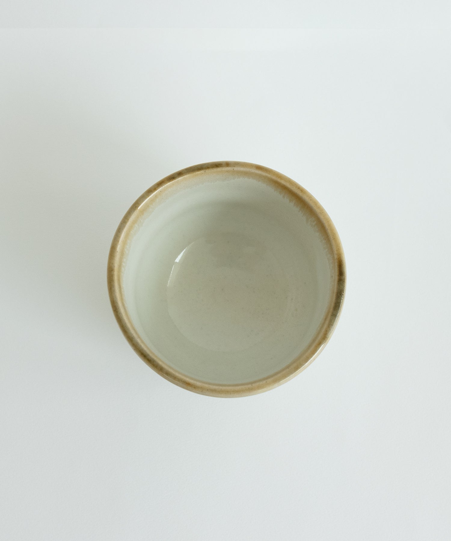 Top view of Japanese Mino pottery matcha bowl, white beige rim glaze handmade ceramic bowl.