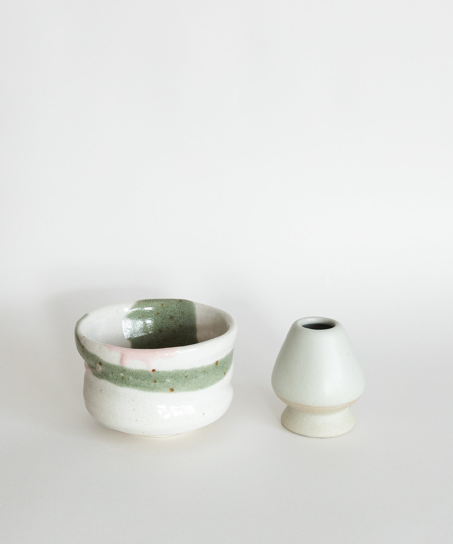 Handcrafted Japanese Mino matcha bowl and ceramic whisk holder set in green and pink glaze, handmade matcha tools pottery UK