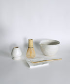 Matcha Whisk Set featuring ceramic bowl, bamboo whisk, scoop, whisk holder and tea towel.