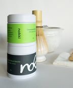 Ceremonial Grade Matcha Powder set, showing two tin cans (Blend and Single Origin).